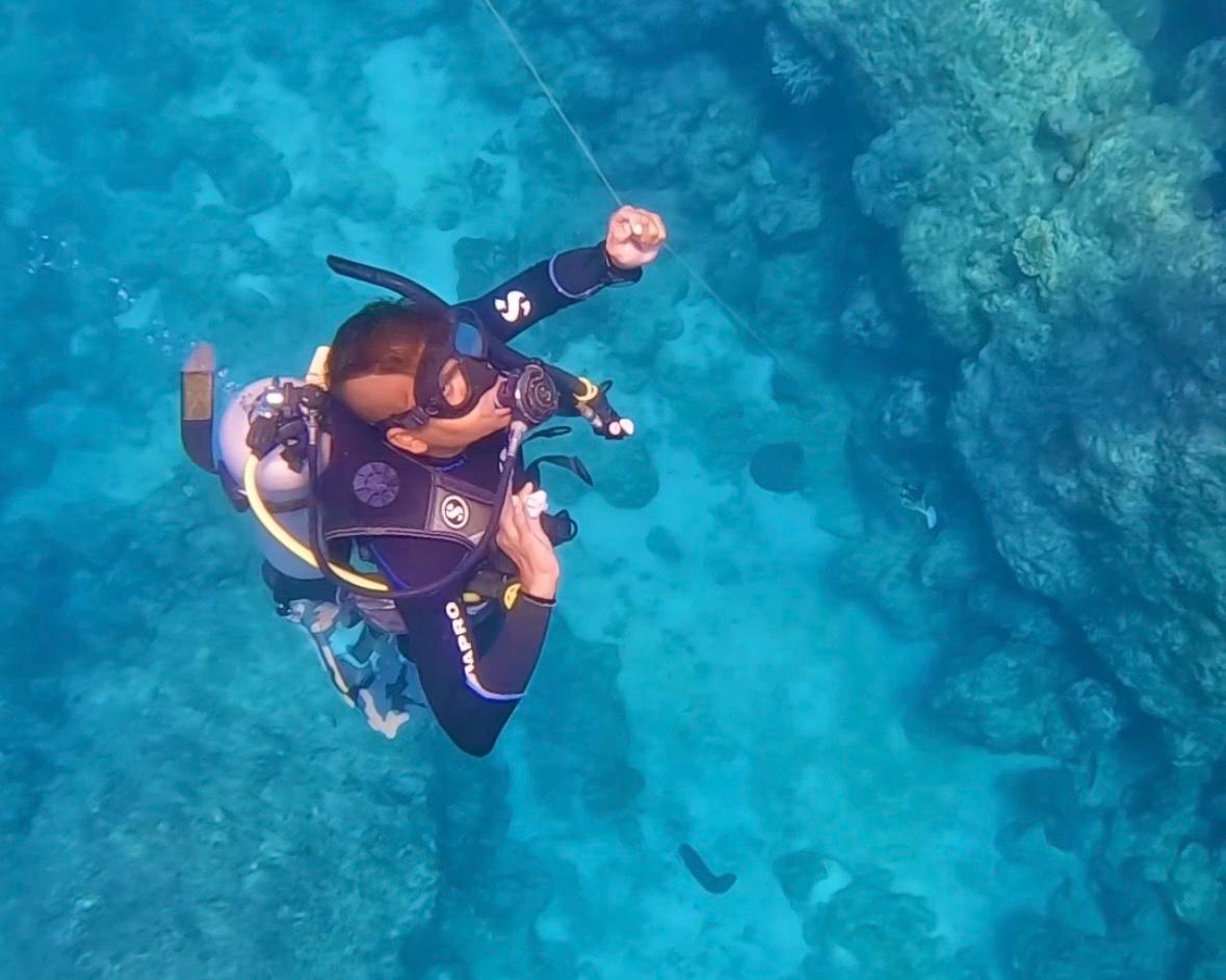 Instructor performing buddy safety check